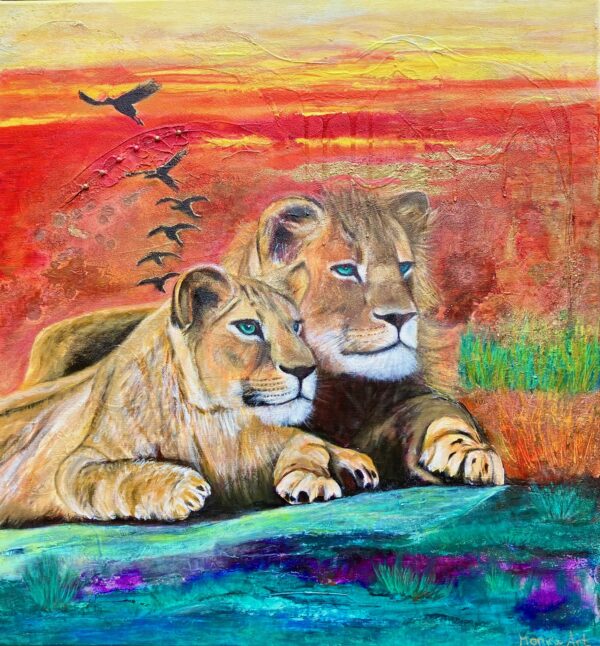 Two lions enjoy sunset